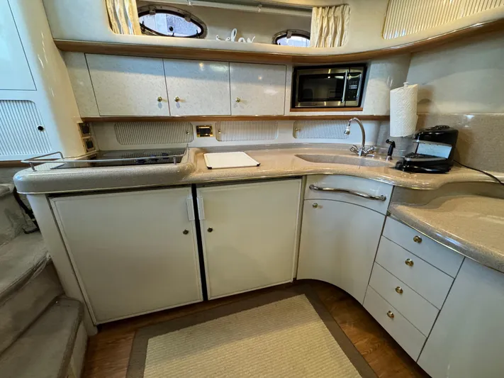 Salad Yacht Photos Pics 1997 Sea Ray 450 Sundancer yacht kitchen with modern appliances and sleek cabinetry.