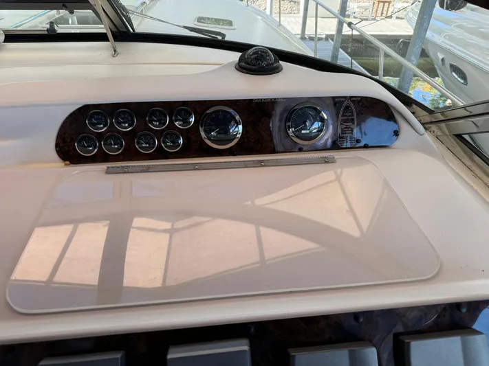 Salad Yacht Photos Pics Control panel of a 1997 Sea Ray 450 Sundancer boat, featuring gauges and navigation instruments.