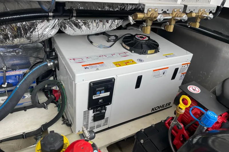 Motivated Yacht Photos Pics Engine room of 2017 Regal 35 Sport Coupe with Kohler generator.