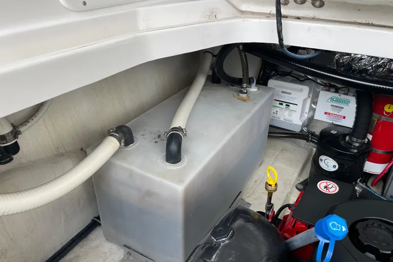 Motivated Yacht Photos Pics 2017 Regal 35 Sport Coupe engine compartment with hoses and equipment.