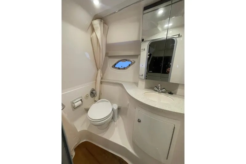Motivated Yacht Photos Pics Luxurious bathroom in 2017 Regal 35 Sport Coupe yacht with modern fixtures and porthole window.