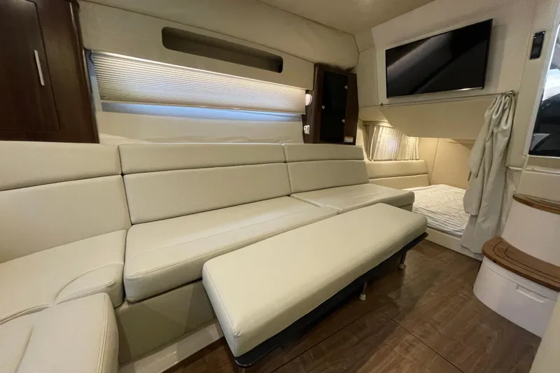 Motivated Yacht Photos Pics Interior of 2017 Regal 35 Sport Coupe with beige seating and modern amenities.