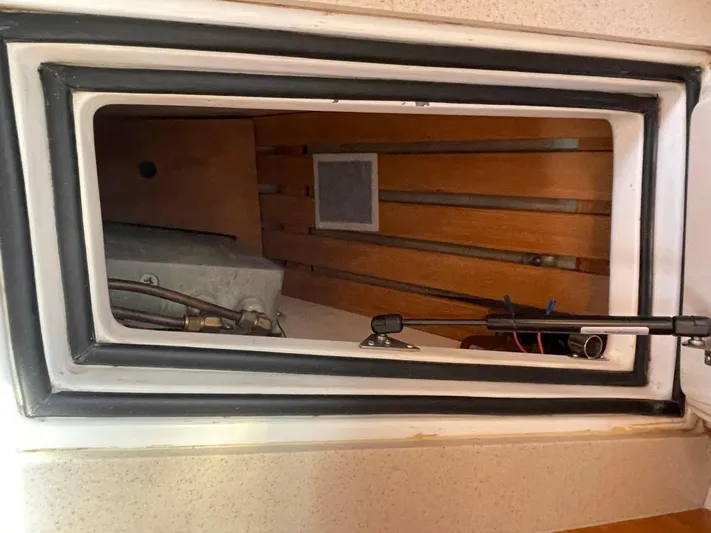 Full Sail Yacht Photos Pics Interior view of a 2003 Tartan 4600 sailboat compartment with visible wiring and wood paneling.