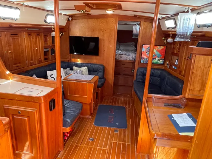 Full Sail Yacht Photos Pics Luxurious 2003 Tartan 4600 yacht interior with wood finish and cozy seating area.