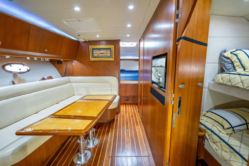 Drill Time Yacht Photos Pics 2006 Tiara Yachts 4200 Open interior with wood finish, seating, and bunk beds.