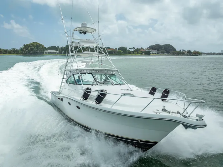 Drill Time Yacht Photos Pics 2006 Tiara Yachts 4200 Open cruising on water, showcasing sleek design and powerful performance.