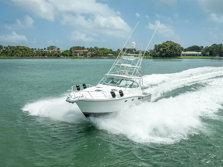 Drill Time Yacht Photos Pics 2006 Tiara Yachts 4200 Open cruising on a sunny day in calm waters.