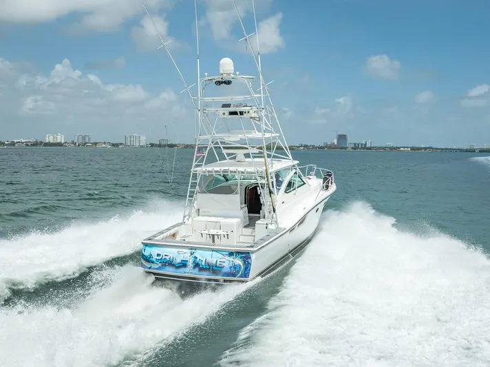 Drill Time Yacht Photos Pics 2006 Tiara Yachts 4200 Open cruising on open water, rear view.