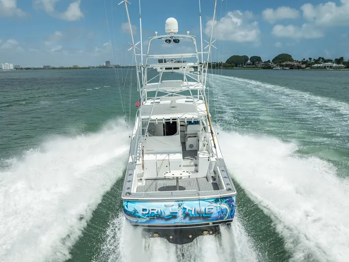 Drill Time Yacht Photos Pics 2006 Tiara Yachts 4200 Open cruising on water, rear view, creating waves.