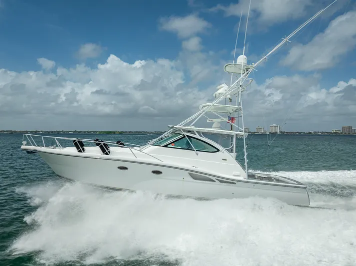 Drill Time Yacht Photos Pics 2006 Tiara Yachts 4200 Open cruising on the ocean under a cloudy sky.
