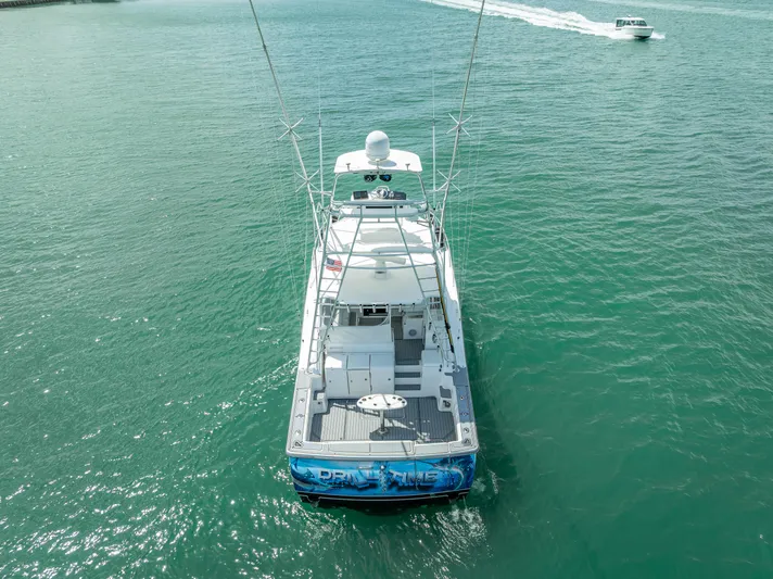 Drill Time Yacht Photos Pics 2006 Tiara Yachts 4200 Open cruising on clear turquoise waters.