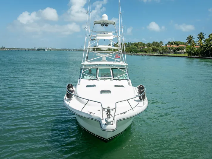 Drill Time Yacht Photos Pics 2006 Tiara Yachts 4200 Open on calm water, clear sky, palm trees in background.