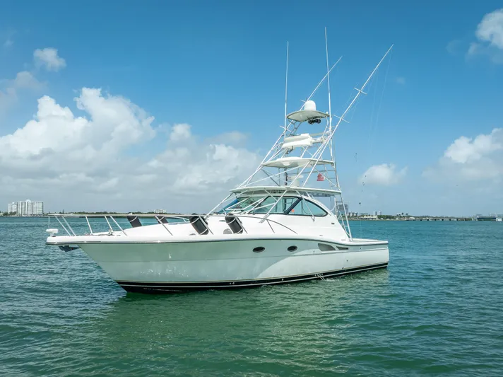 Drill Time Yacht Photos Pics 2006 Tiara Yachts 4200 Open on calm water under a clear blue sky.