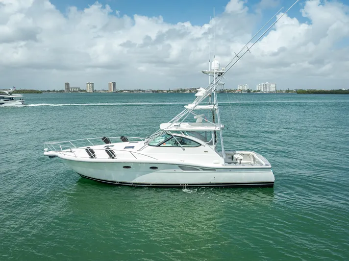 Drill Time Yacht Photos Pics 2006 Tiara Yachts 4200 Open on calm water, under a partly cloudy sky.