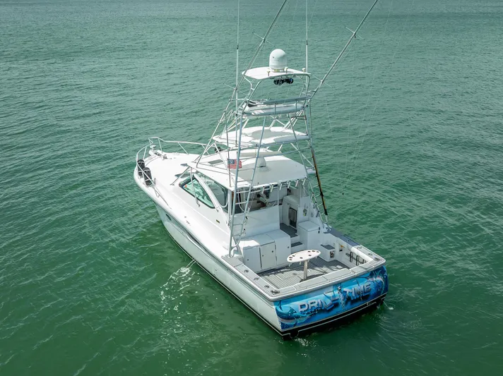 Drill Time Yacht Photos Pics 2006 Tiara Yachts 4200 Open on calm water, showcasing sleek design and fishing equipment.