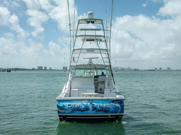 Drill Time Yacht Photos Pics 2006 Tiara Yachts 4200 Open on water, rear view, clear sky.