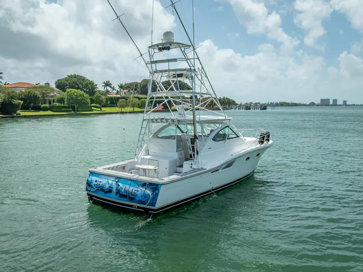 Drill Time Yacht Photos Pics 2006 Tiara Yachts 4200 Open on calm water, featuring a sleek design and fishing tower.