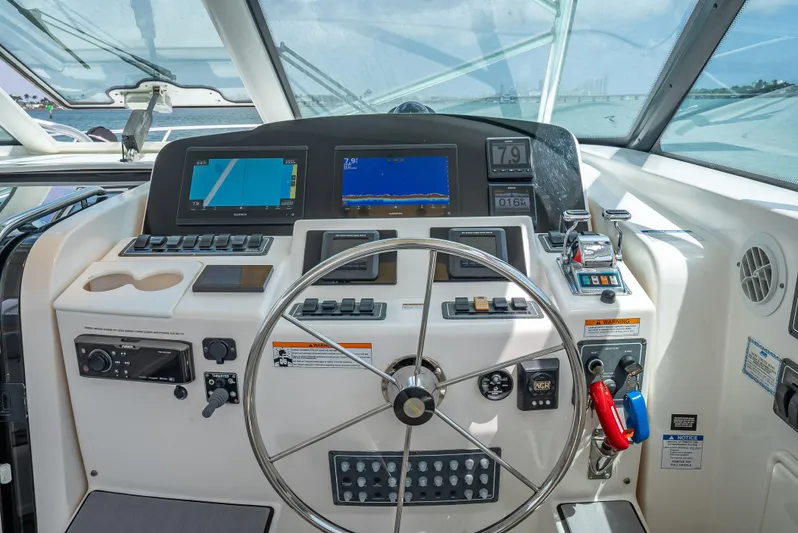 Drill Time Yacht Photos Pics Helm of 2006 Tiara Yachts 4200 Open with navigation screens and controls.