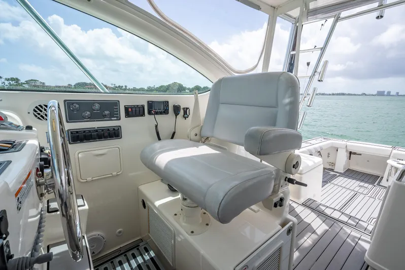 Drill Time Yacht Photos Pics Captain's chair on 2006 Tiara Yachts 4200 Open, overlooking serene waters.