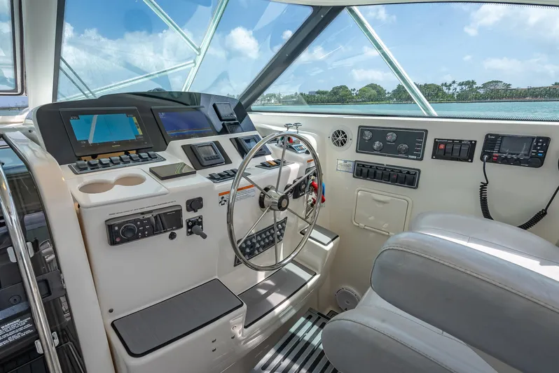 Drill Time Yacht Photos Pics 2006 Tiara Yachts 4200 Open helm with modern controls and ocean view.