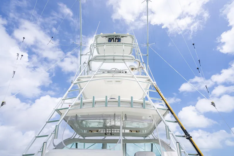 Drill Time Yacht Photos Pics 2006 Tiara Yachts 4200 Open against a bright blue sky with clouds.