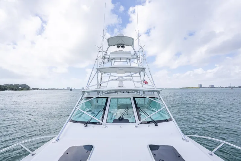 Drill Time Yacht Photos Pics 2006 Tiara Yachts 4200 Open on calm waters under a cloudy sky.