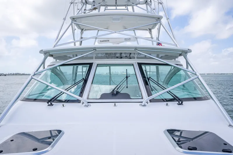 Drill Time Yacht Photos Pics 2006 Tiara Yachts 4200 Open, front view, on calm water under a cloudy sky.