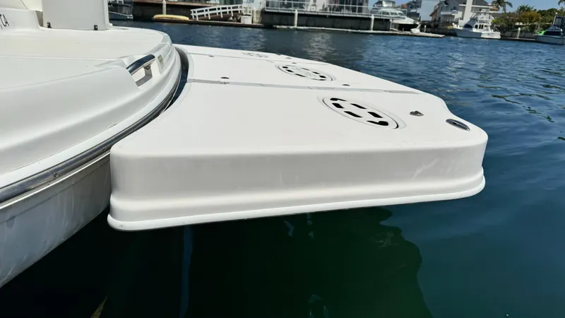  Yacht Photos Pics 2007 Sea Ray 44 Sundancer swim platform on calm water, showcasing sleek design.