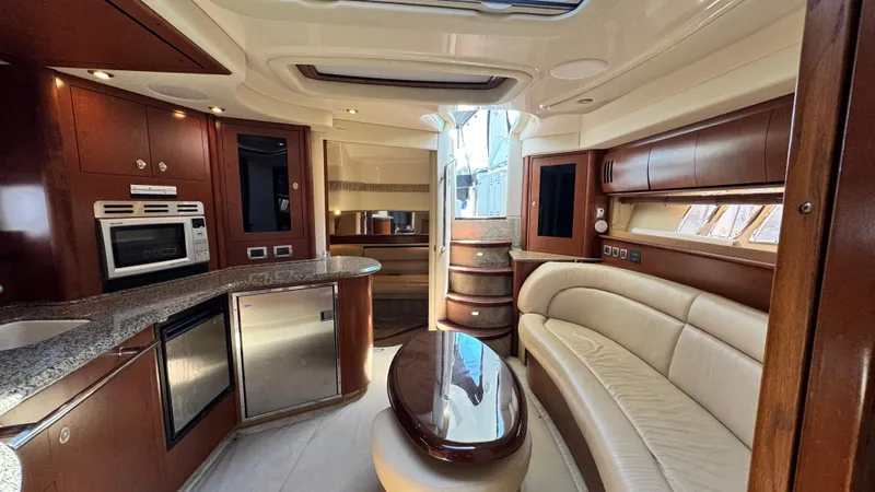  Yacht Photos Pics Luxurious interior of a 2007 Sea Ray 44 Sundancer yacht with modern kitchen and seating area.
