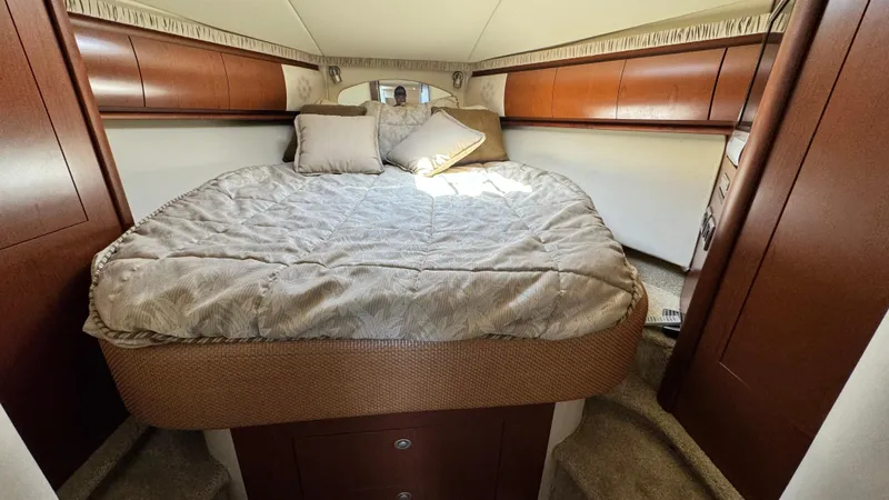  Yacht Photos Pics Luxurious cabin interior of 2007 Sea Ray 44 Sundancer yacht with cozy bedding.