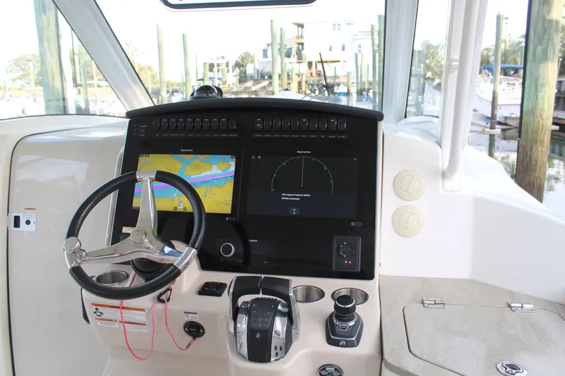 Get Off Me Yacht Photos Pics Boston Whaler 350 Realm 2021 helm with navigation system.