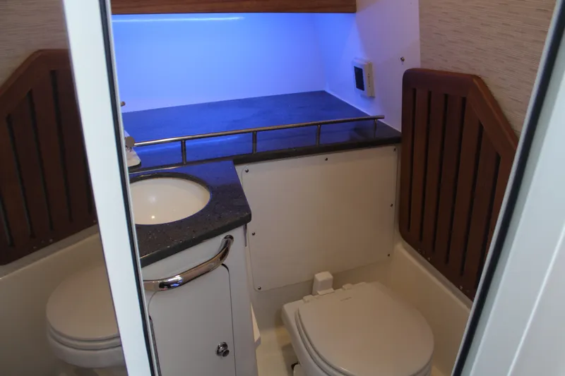 Get Off Me Yacht Photos Pics Interior of 2021 Boston Whaler 350 Realm with toilet and sink.