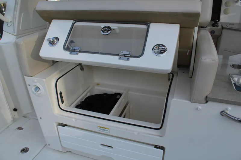 Get Off Me Yacht Photos Pics 2021 Boston Whaler 350 Realm, open storage compartment on boat.
