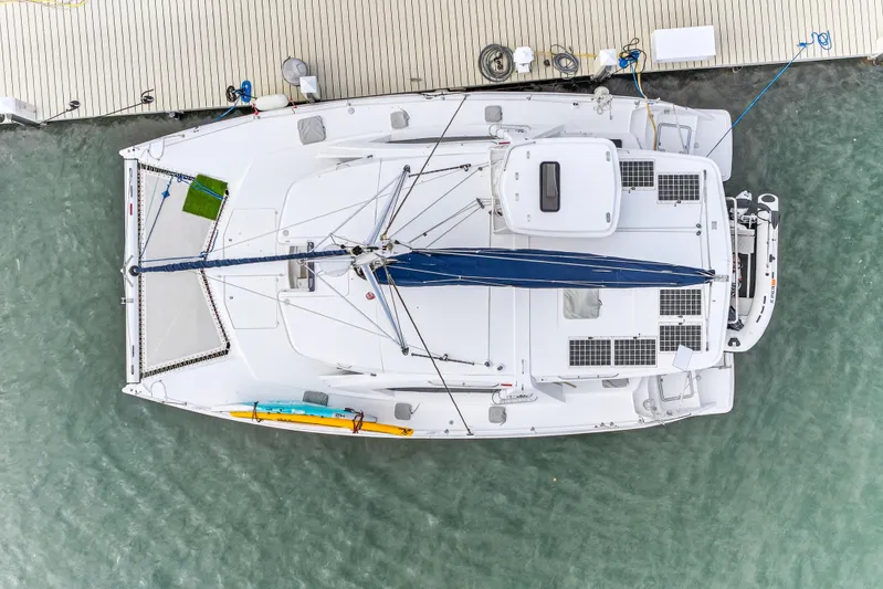  Yacht Photos Pics Aerial view of 2016 Leopard 44 Owners Version catamaran docked at a marina.