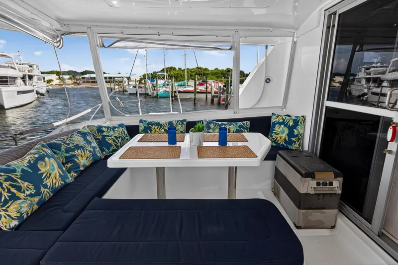  Yacht Photos Pics Leopard 44 Owners Version 2016 yacht interior with cushioned seating and dining area.