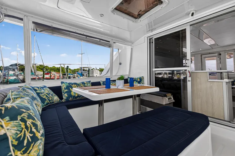  Yacht Photos Pics Interior of 2016 Leopard 44 Owners Version yacht with elegant seating and dining area.