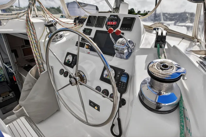  Yacht Photos Pics Helm of 2016 Leopard 44 Owners Version catamaran with steering wheel and navigation controls.