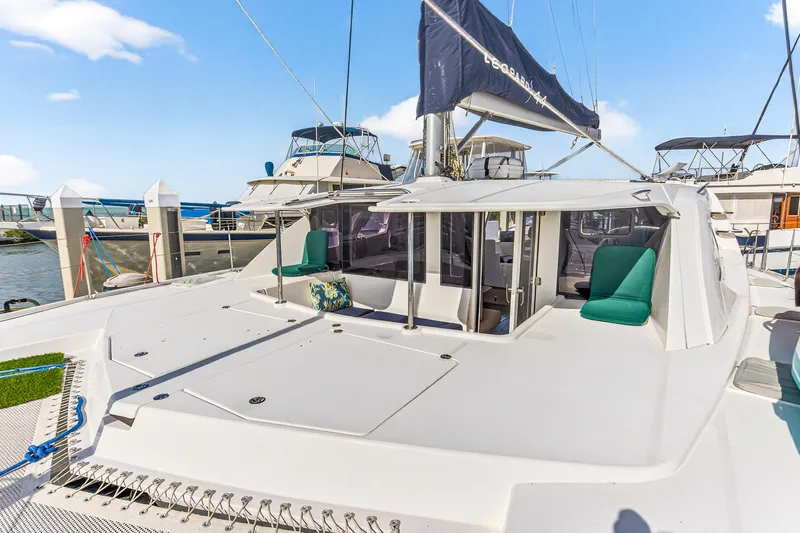  Yacht Photos Pics 2016 Leopard 44 Owners Version catamaran docked, featuring spacious deck and seating area.