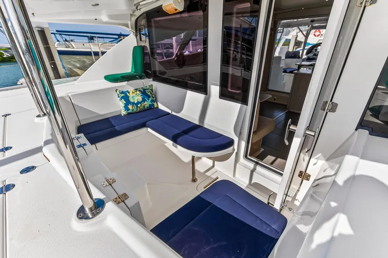  Yacht Photos Pics 2016 Leopard 44 Owners Version yacht cockpit with blue seating and floral cushion.
