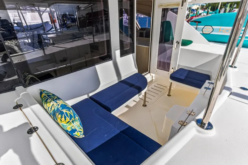  Yacht Photos Pics 2016 Leopard 44 Owners Version yacht with blue seating and tropical pillow.