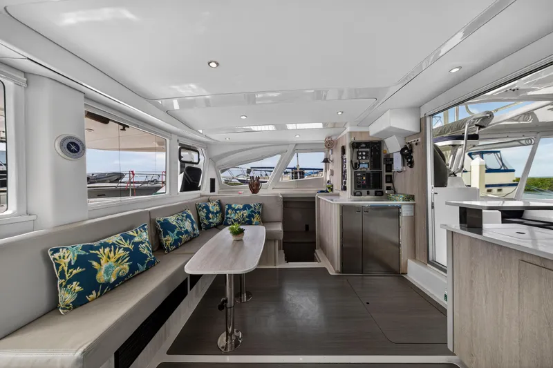  Yacht Photos Pics Luxurious interior of 2016 Leopard 44 Owners Version catamaran with modern design and vibrant cushions.