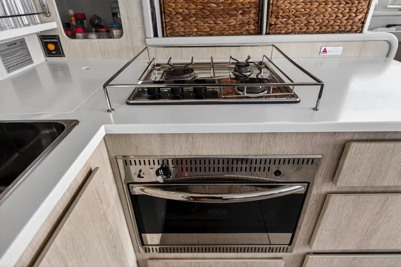  Yacht Photos Pics Modern kitchen in 2016 Leopard 44 Owners Version yacht with stove and oven.