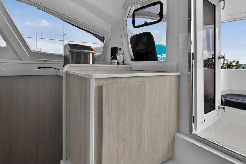  Yacht Photos Pics Interior of 2016 Leopard 44 Owners Version yacht, featuring modern cabinetry and seating.