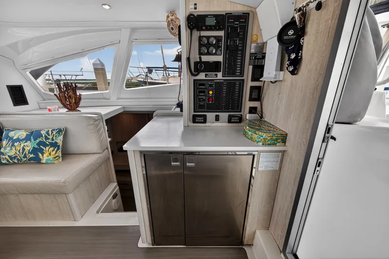  Yacht Photos Pics Interior of 2016 Leopard 44 Owners Version yacht with control panel and seating area.