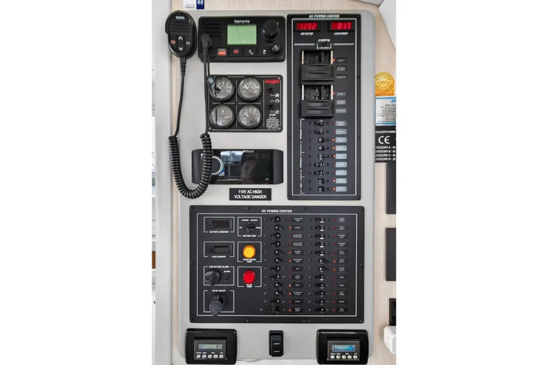  Yacht Photos Pics Control panel of a 2016 Leopard 44 Owners Version catamaran, featuring various gauges and switches.