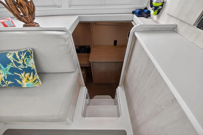  Yacht Photos Pics Interior of 2016 Leopard 44 Owners Version yacht with stairs and seating area.