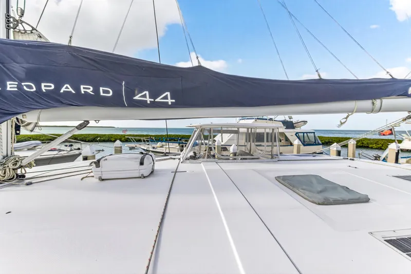  Yacht Photos Pics 2016 Leopard 44 Owners Version catamaran docked, featuring spacious deck and sail cover.