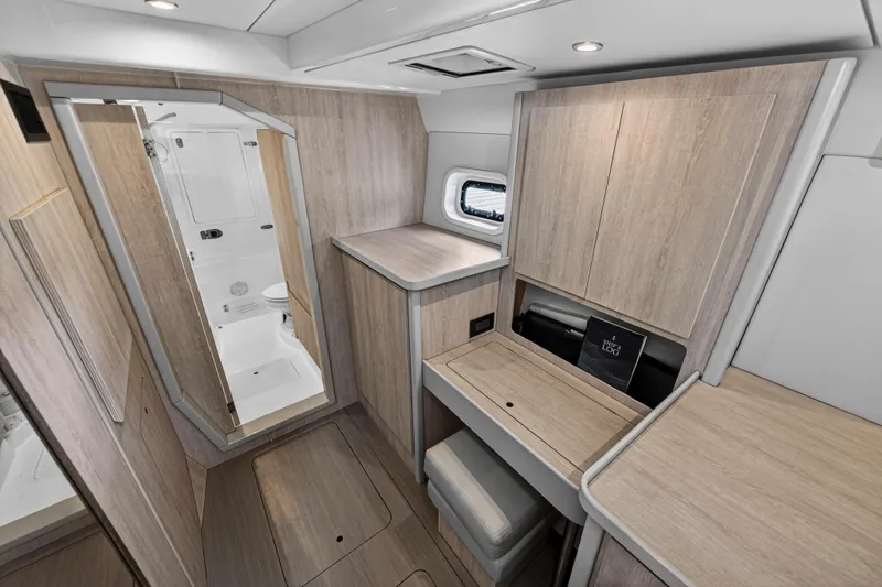  Yacht Photos Pics Modern interior of 2016 Leopard 44 Owners Version yacht with wood finish and compact design.