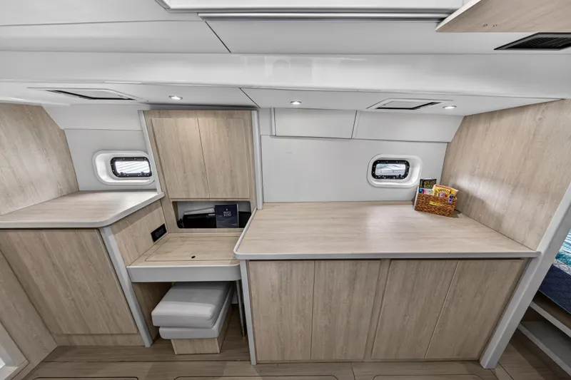  Yacht Photos Pics Modern interior of 2016 Leopard 44 Owners Version yacht with light wood cabinetry.