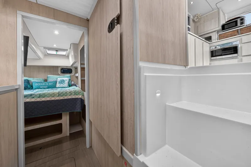  Yacht Photos Pics 2016 Leopard 44 Owners Version interior with cozy bedroom and modern kitchen.